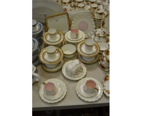 A Sutherland china part tea service; a Staffordshire part tea service , pink interior (2)