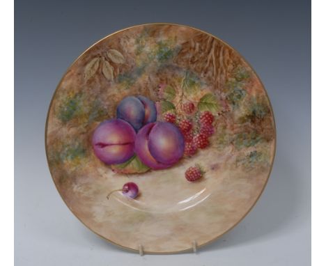 A Royal Worcester circular plate, painted by Frank Higgins, signed with ripe peaches and raspberries on a mossy ground, 26cm 