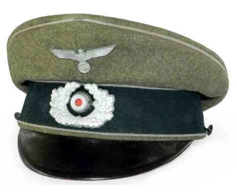 A Third Reich German Army Propaganda Troops officers visor cap (Propagandatruppen) constructed of green wool with light grey 