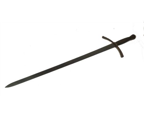 A North-European medieval-style greatsword with wire bound grip the double-edged blade cut with a short fuller and twin arrow
