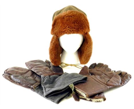 A WW2 RAF sheepskin lined cold weather kit hat, the interior quilted and stamped with War Department arrow and retailers labe