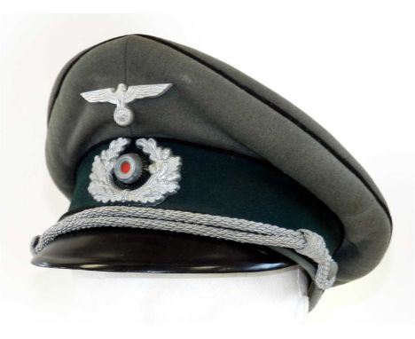 A German Third Reich Army Combat Engineer "Pioneer" Officer’s visor cap constructed of field grey wool with dark green centre