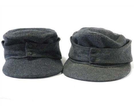 A German Third Reich Luftwaffe M43 Field/Ski cap lacking insignia constructed of blue-grey wool with fold down back and side 