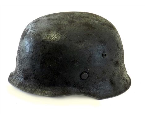 A 1930s German child’s play helmet or ‘Kinderhelm’ with interior light brown leather liner and dark brown leather chinstrap