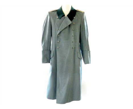 A German Third Reich Army Greatcoat constructed of field grey with dark green collars, the shoulders with boards for Wehrmach