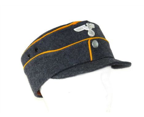 A Third Reich German National Socialist Flyers Corps (NSFK) NCO kepi, constructed of a blue/grey wool fabric body and stiffen