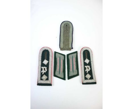 A pair of Army Panzerjäger shoulder boards for an Oberscharführer constructed of dark green wool with silver braided edge and