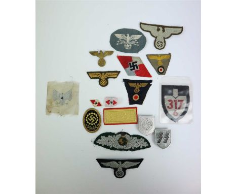 A group of assorted German Third Reich insignia comprising two Hitler Youth bevo weave diamonds as worn on overseas caps, a H