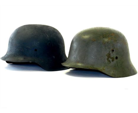 A German Third Reich M42 helmet shell painted naval grey with a rough texturized exterior finish, interior stamped ‘1275’ (la