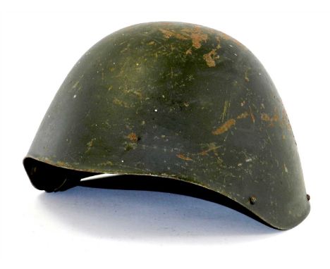 A scarce WW2 Greek M1934/39 steel combat helmet with original seven finger brown leather liner and chinstrap