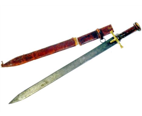 A Kaskara sword from the Sudan region 19th century, the 66cm length blade etched to both sides with Islamic inscriptions, wit