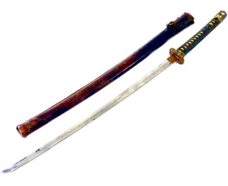 A Japanese katana sword, possibly 19th century with a wrapped white shagreen handle covering the signed manuki and with an or