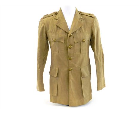 An Indian Army Officer's tunic - 7th Rajput Division, well tailored of khaki cloth with bronzed buttons, shoulder titles and 