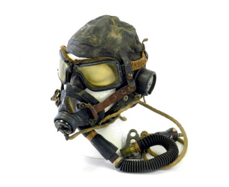 A British Second World War brown leather Type C flying helmet with pair of goggles the helmet named to F/Lt. Kennard, dated F