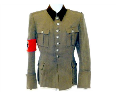 A German Third Reich service tunic – possibly RAD or NSKK constructed of green woollen/rayon blend with a chocolate brown col