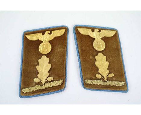 A pair of German Third Reich collar tabs for an Oberabscnhittsleiter at Orts-level constructed of light brown velvet with blu