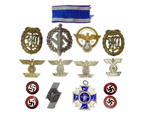 German Third Reich Political and Civil Awards comprising Kreissieger badge 1939, two D.R.A. sports badges (one with swastika,