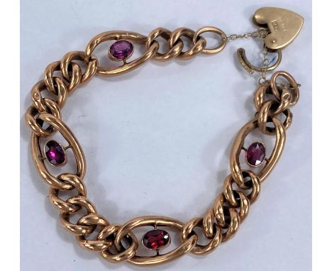 A curb chain bracelet formed from triple and elongated links, set 4 amethyst coloured stones, 12.2 gm 