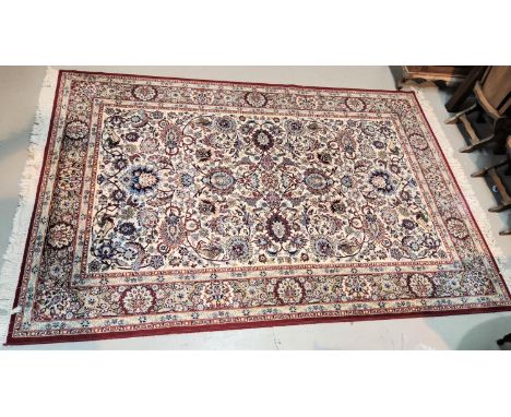 A fawn ground Persian design "Keshan" carpet square 10' 4" x 6' 8" 