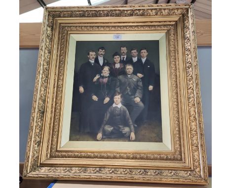 A Victorian family group portrait, photo heightened in watercolour, in ornate gilt frame 
