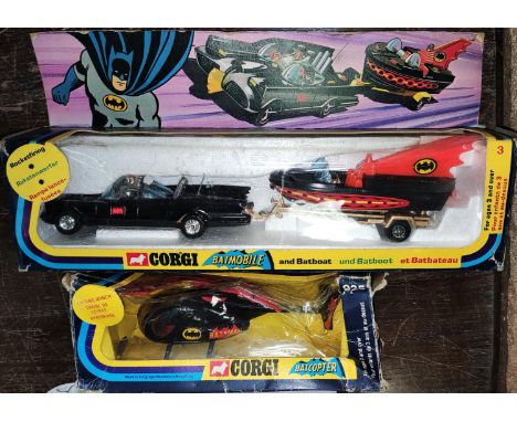A vintage Corgi Batmobile and Batboat No 3 boxed (box a bit knocked and plastic split) a vintage Batcopter No 925 (box a.f) 