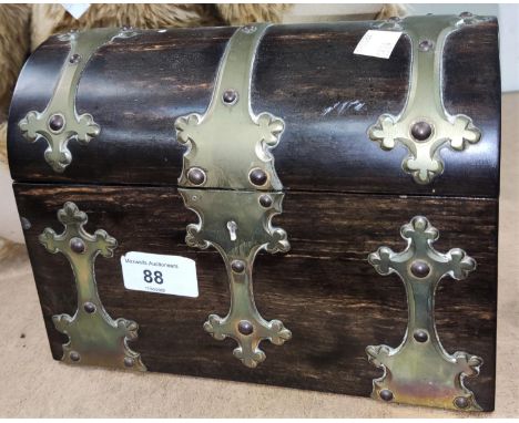 A 19th century coromandel tea caddy with dome top, 2 divisions and ornate brass mounts.&nbsp; Generally in good condition, th