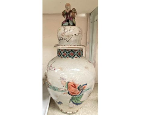 A Chinese stoneware lidded vase, decorated with polychrome figures &amp; prunus blossom with reticulated rim, tall lid with f