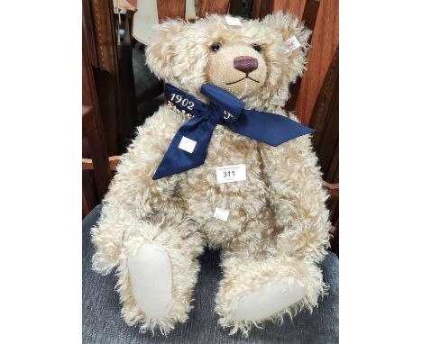 A Steiff Classic 1902-2002 teddy bear with navy blue and gold ribbon, length 44cm 