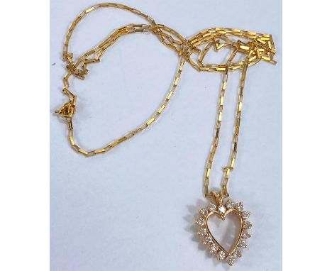 A yellow metal heart shaped pendant set 16 diamonds, unmarked tests as circa 14 ct, on fine chain, stamped '9kt', 4.7 gm gros
