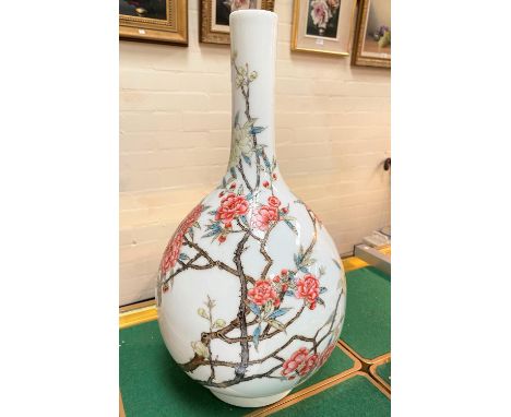 A Chinese bulbous slender neck vase, possibly Republic period decorated in polychrome with flowering branches, blue painted s