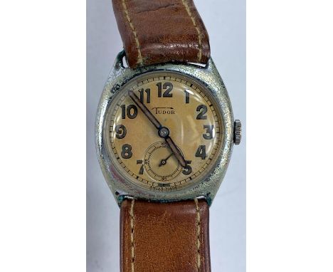 A vintage 1950's "Tudor" stainless steel gent's wristwatch on leather strap.&nbsp;&nbsp;The Tudor does wind and ticks a bit, 