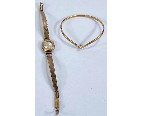 A ladies Avia 9 carat hallmarked gold wristwatch on gold plated strap; a 9 carat hallmarked gold set single simulated diamond