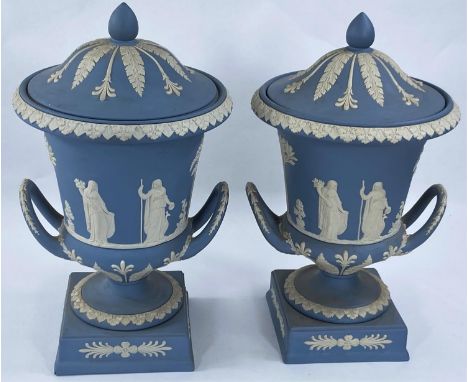 A Wedgwood light blue Jasperware pair of urn shaped vases with covers, height 30 cm.&nbsp;&nbsp;A little dusty, but in good c