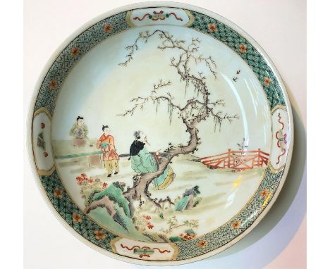 A Chinese famille verte dish decorated with traditional scene, diameter 29cm.&nbsp;In good condition, with some staining to t