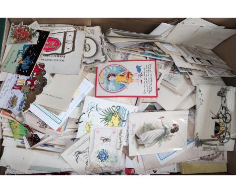 A large selection of vintage greetings cards, some silks etc 