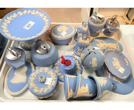 A selection of Wedgwood light blue Jasperware:&nbsp; bells; covered trinket pots; table lighters; etc.