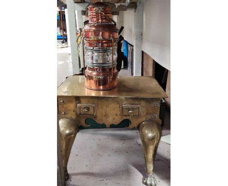 A ships copper "Anchor" lamp; a 19th century brass footman.&nbsp;&nbsp;Both items in good condition.