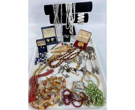 A selection of vintage costume jewellery in red case 