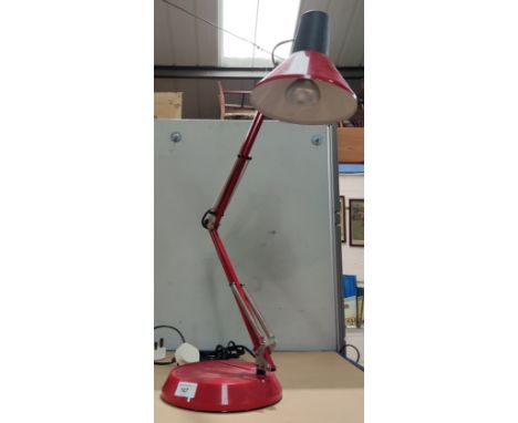 A red angle poise lamp 