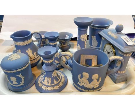 A selection of Wedgwood light blue Jasperware:&nbsp; clock; loving cup; candlesticks; etc. 
