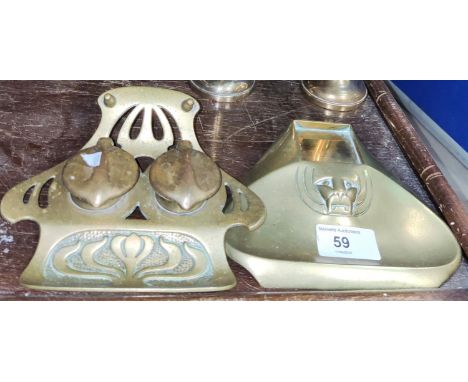 An Art Nouveau style brass double inkwell; a pair of brass candlesticks; a brass inkbottle tray 