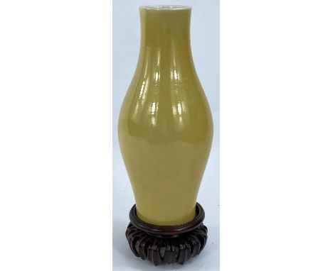 A Chinese yellow enamelled porcelain vase of ovoid form, 6 character mark to base, 17cm (Good condition) and hardwood stand