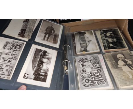 An album of vintage postcards, various military, humour etc