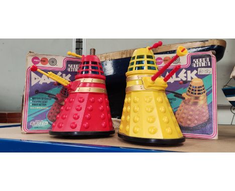 Two vintage Daleks by Marx, in original boxes, one red, one yellow 