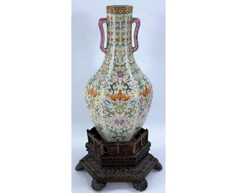 A Chinese porcelain vase of hexagonal baluster form with loop handles, stylised floral decoration with patterned borders, squ