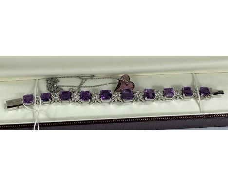 A white metal Tiffany heart bangle, stamped '925', in original box; a bracelet set square amethyst coloured stones, and simil