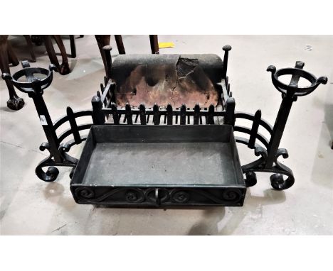 A wrought iron dog grate 