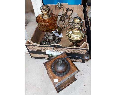 A 3 branch centre light with frosted glass shades; 2 19th century oil lamps; a coffee grinder 