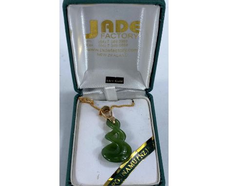 A jade pendant on chain, loop stamped 14ct, 7.00gm gross 
