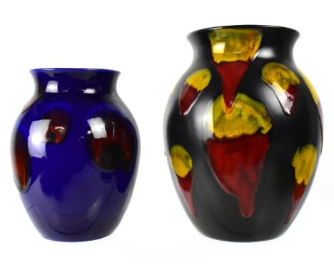 POOLE; a large baluster vase in the 'Lava' pattern by Alan Clarke, black ground with vibrant red and yellow drip glaze, heigh